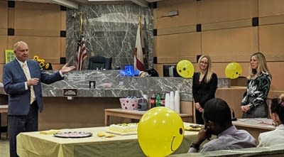Chief Judge Jack Tuter introduces Judge Stacey Schulman (left) and Judge Stacy Ross (right).