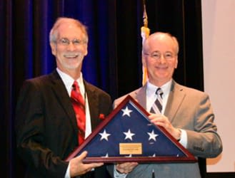 Chief Justice Charles Canady poses with 2019 Judicial Excellence Award recipient Judge David Denkin, Sarasota County.